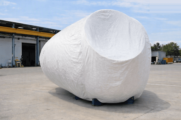 Windmill Head HDPE Bag — large fitted cover protecting a wind turbine hub during transit and storage